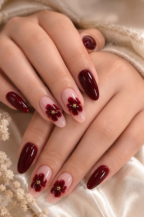 Burgundy almond nails with red floral accent nails for women over 50