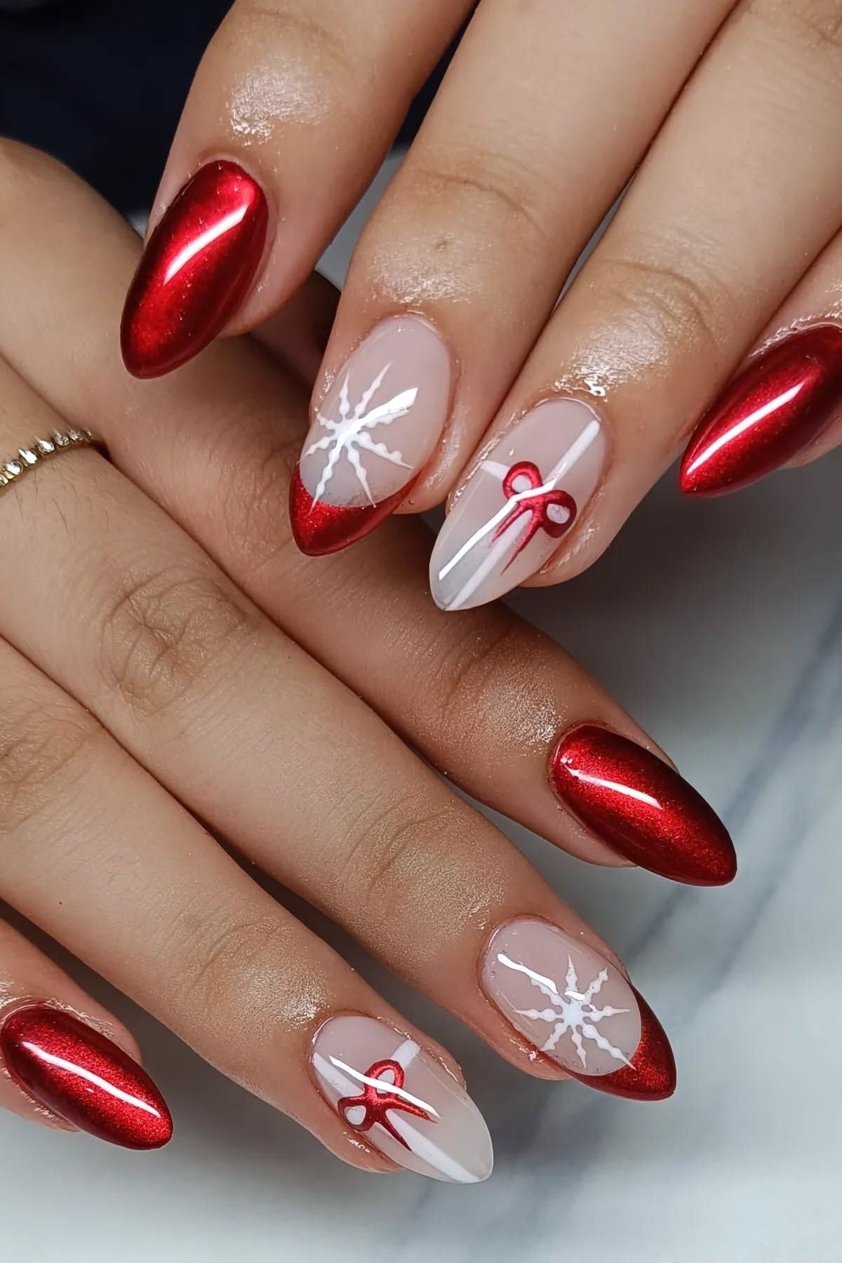 red chrome christmas nails with white snowflake art for women over 70