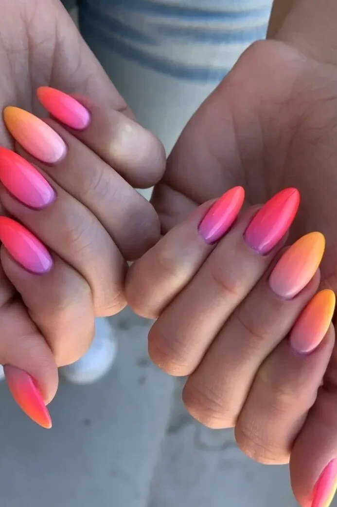 Pink to Orange Sunset Almond Nails - This classic look melts soft pink at the cuticle into warm orange at the tips.