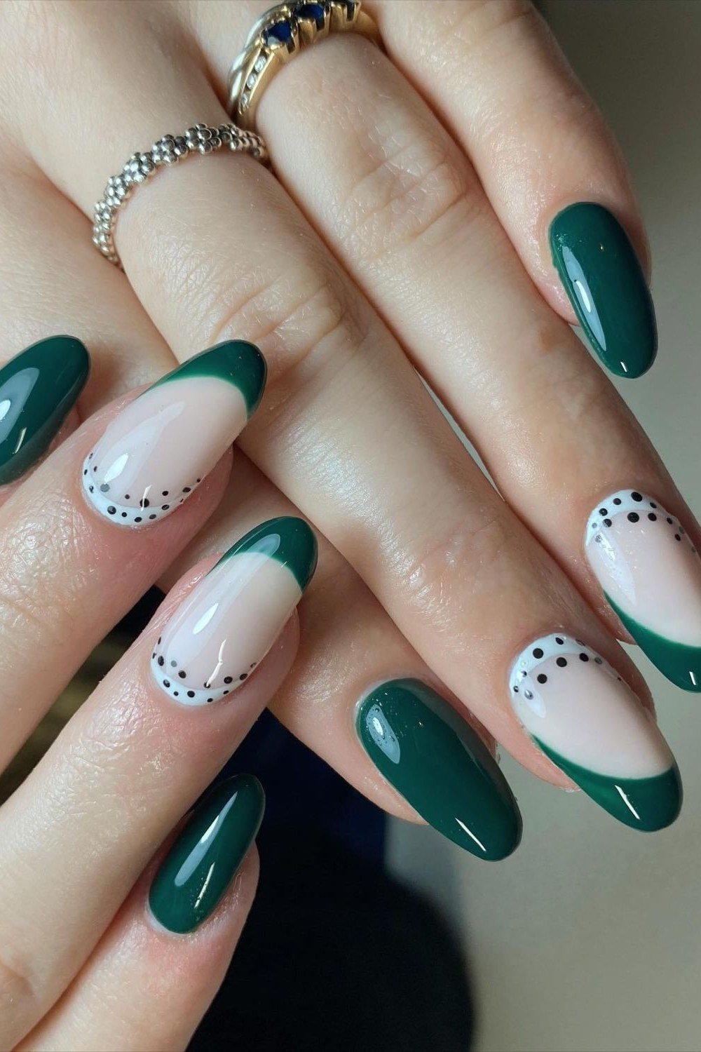 emerald green and nude french tips with dot details, almond
