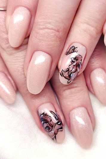 Blush pink almond nails with hand-painted Bambi portrait for women over 50