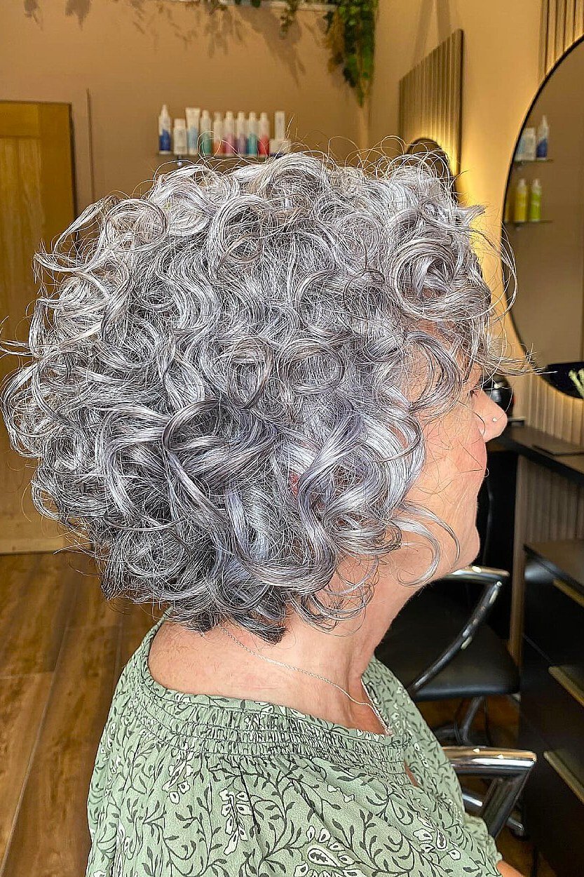 Rounded grey curly bob haircut for women over 50