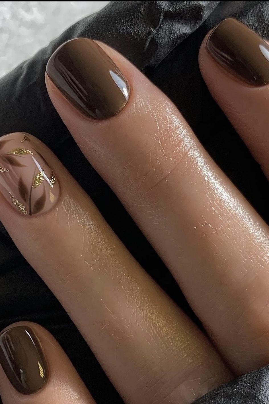 Espresso oval glossy with gold marble accent nail, elegant fall nail design for women over 40
