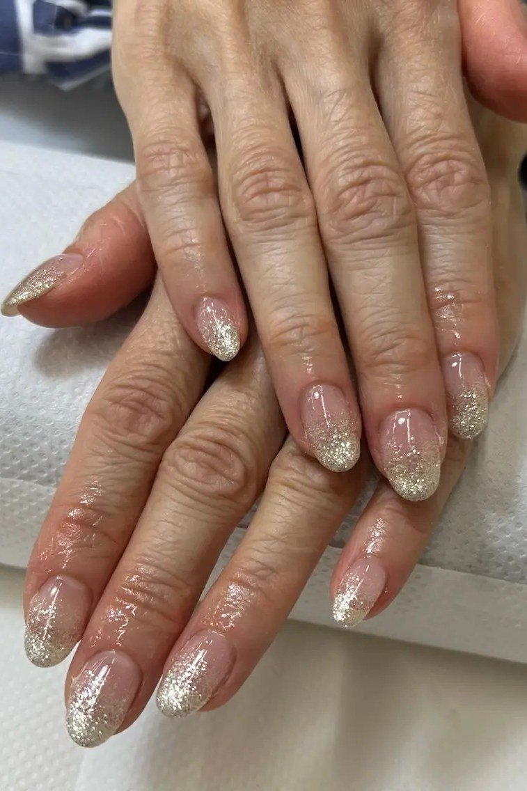 Gold Glitter French Ombre Almond Nails - gold glitter french ombre almond mature hands, glitter winter nail design for women over 60