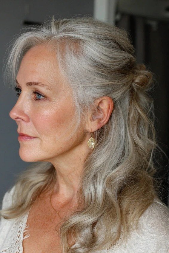 Long white-gray wavy half-up with face framing for women over 50