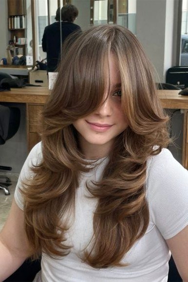 Salon Blowout Butterfly Cut with Soft Curtain Bangs - butterfly cut hairstyle for women over 60