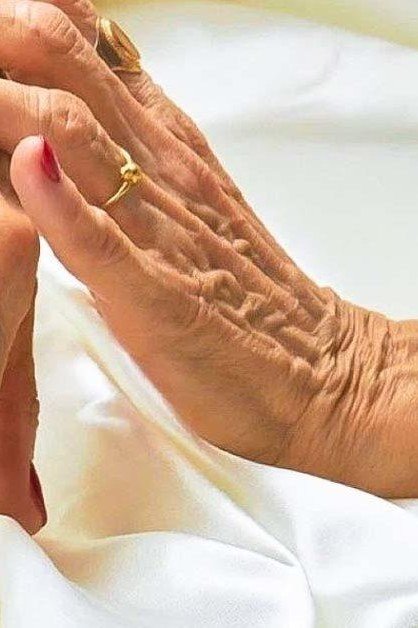 Bright Red Manicure on White Satin for women over 60