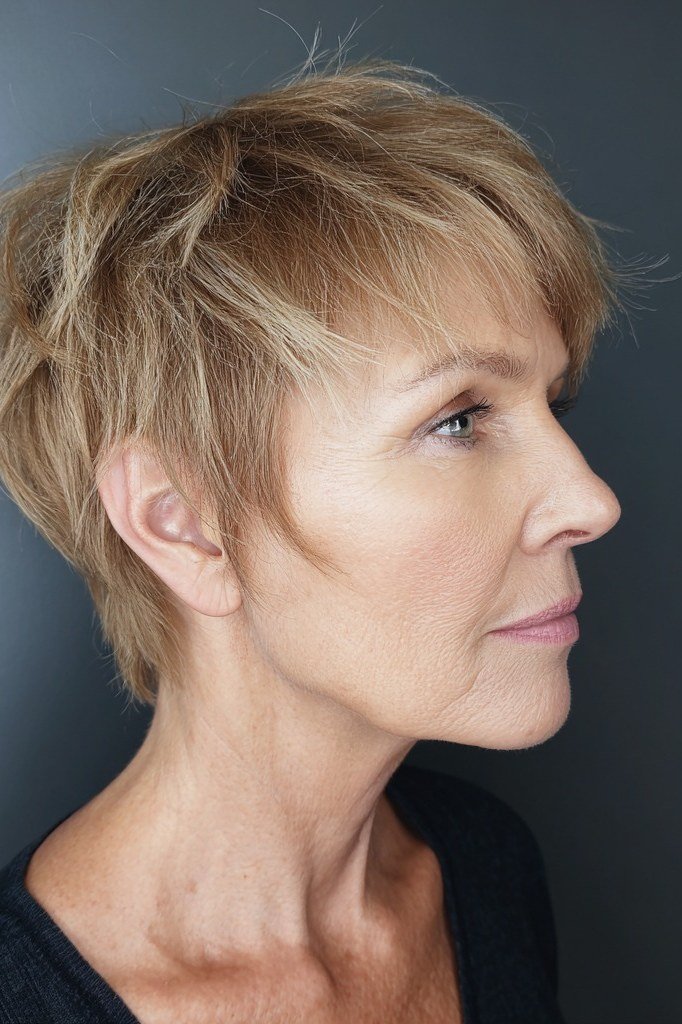 Honey blonde textured pixie, side view - wispy hairstyle for women over 40