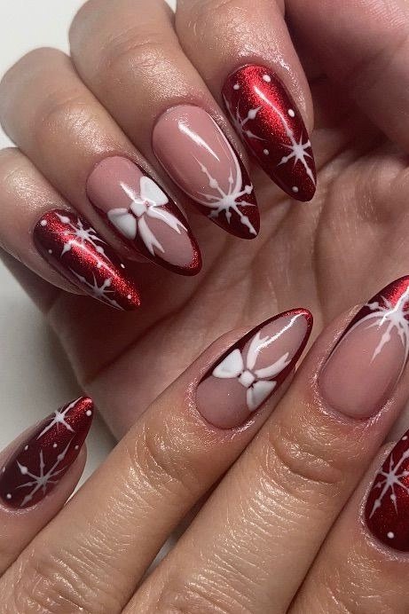 red chrome nails with silver starburst nail art