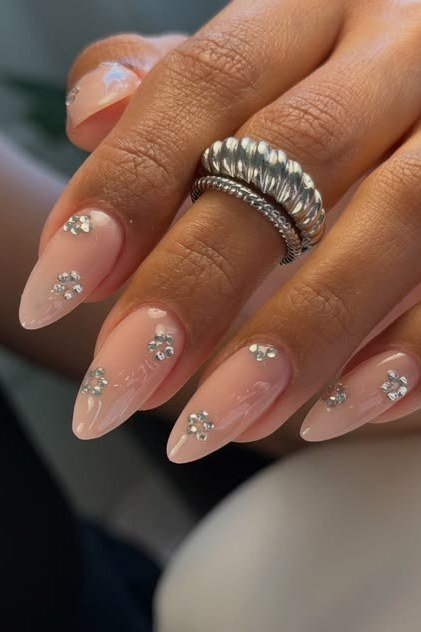 Nude Almond with Tiny Crystal Accents - elegant nail art idea for mature hands, women over 50