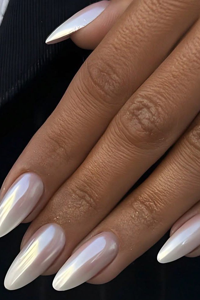 Pearl chrome milky white almond nails on dark skin