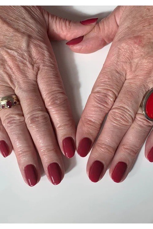 Classic Cherry Red Short Oval Nails - winter nail trend for older women over 70