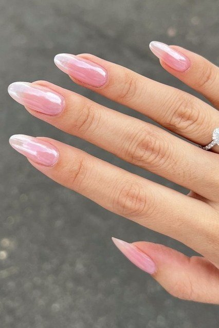 Sheer pinky glazed oval nails, glossy finish