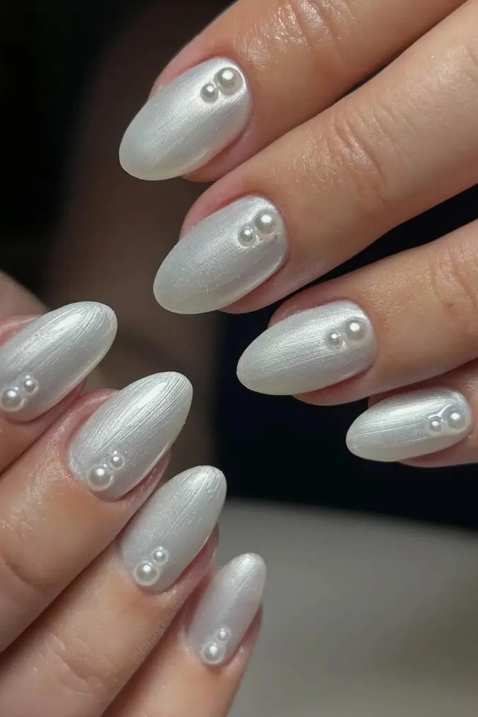 Icy White Pearl Almond Nails - pearl finish nail idea for women over 60