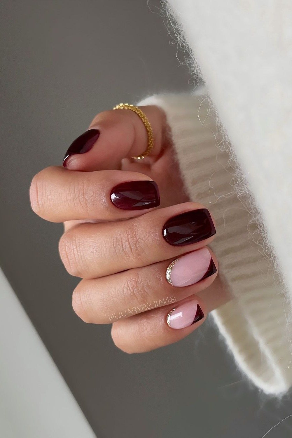 Deep Burgundy Short Almond Nails with a Nude Accent, fall nail color idea for women over 50