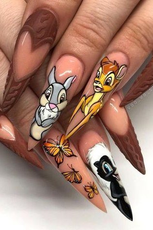 Long chocolate brown stiletto nails with Bambi and Thumper portraits fall nail art