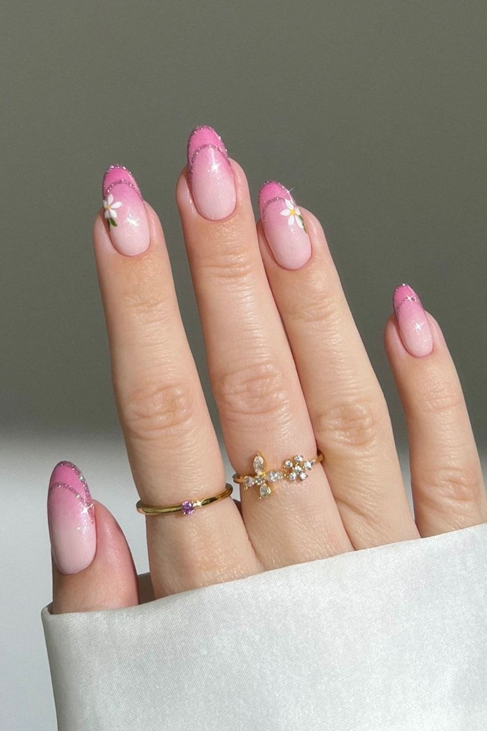 Pink almond nails with rhinestone accents