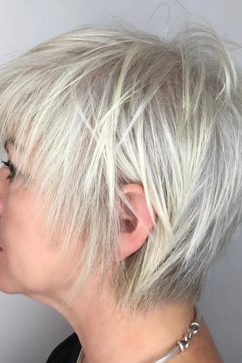 white piecey layered pixie haircut side view for older women