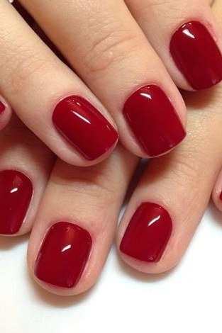 Oxblood deep red glossy nails, elegant, sophisticated nail design for women over 50