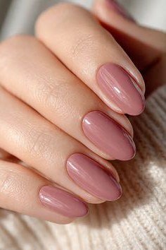 Glossy Mauve Almond Nails with a Pink Undertone, elegant mauve nail idea for women over 60