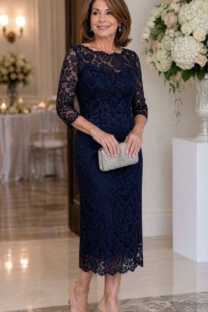 Navy lace sheath dress with 3/4 sleeves, silver clutch - wedding guest outfit for women over 50