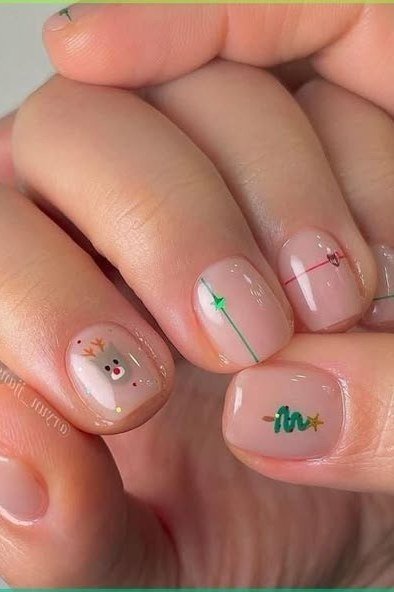 Sheer nails with minimal Christmas tree and star line art - classy Christmas nail idea for women over 70