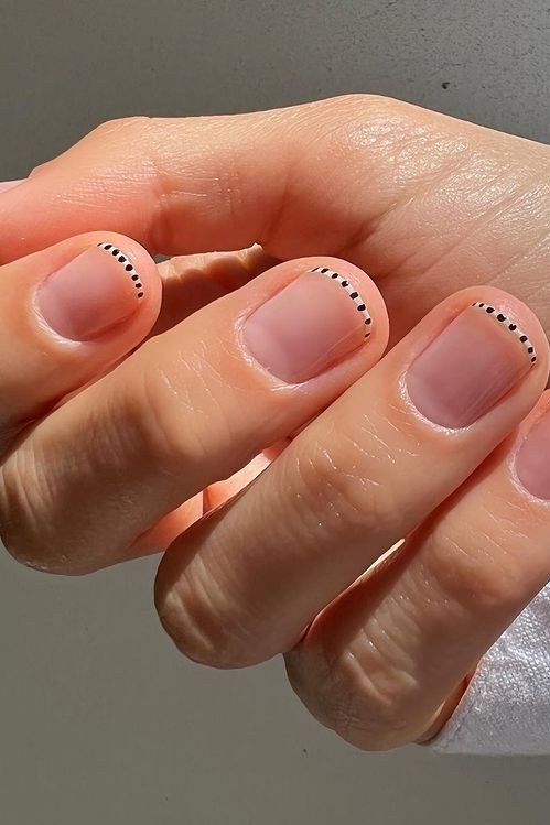 nude pink short nails with dotted cuticle detail