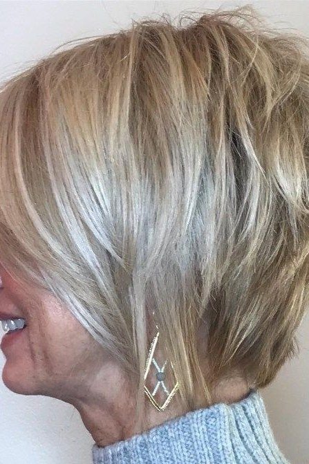 Silver layered bob, side view, smiling woman - wispy hairstyle for women over 40