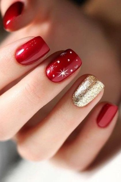 Deep red with gold glitter accent nail, starburst art - Christmas nail design for older women