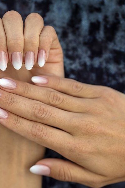 White to pink ombre on mature hands, medium almond nails, ombre nail design for women over 60