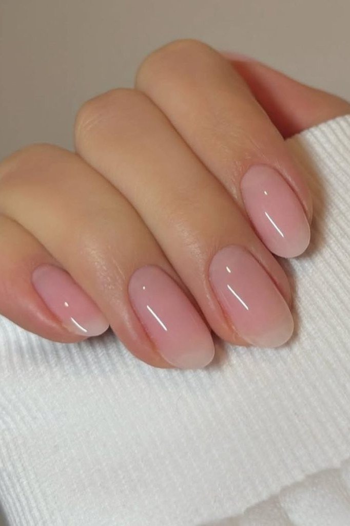 Blush pink short oval glossy minimal, elegant fall nail design for women over 40