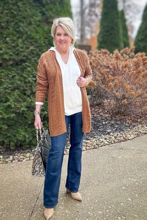 Rust cable knit cardigan with white top and jeans, fall outfit for women over 40