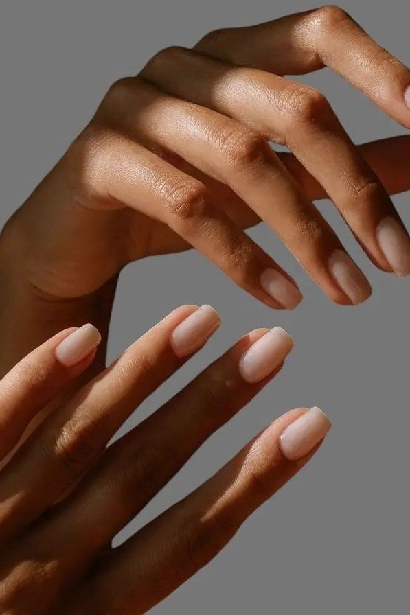 natural nude short oval gel nails matched to skin tone, mature hands manicure