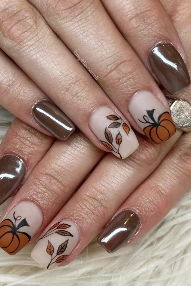 5. Bronze Chrome Nails With Subtle Pumpkin Art - Thanksgiving nail art idea for women over 50