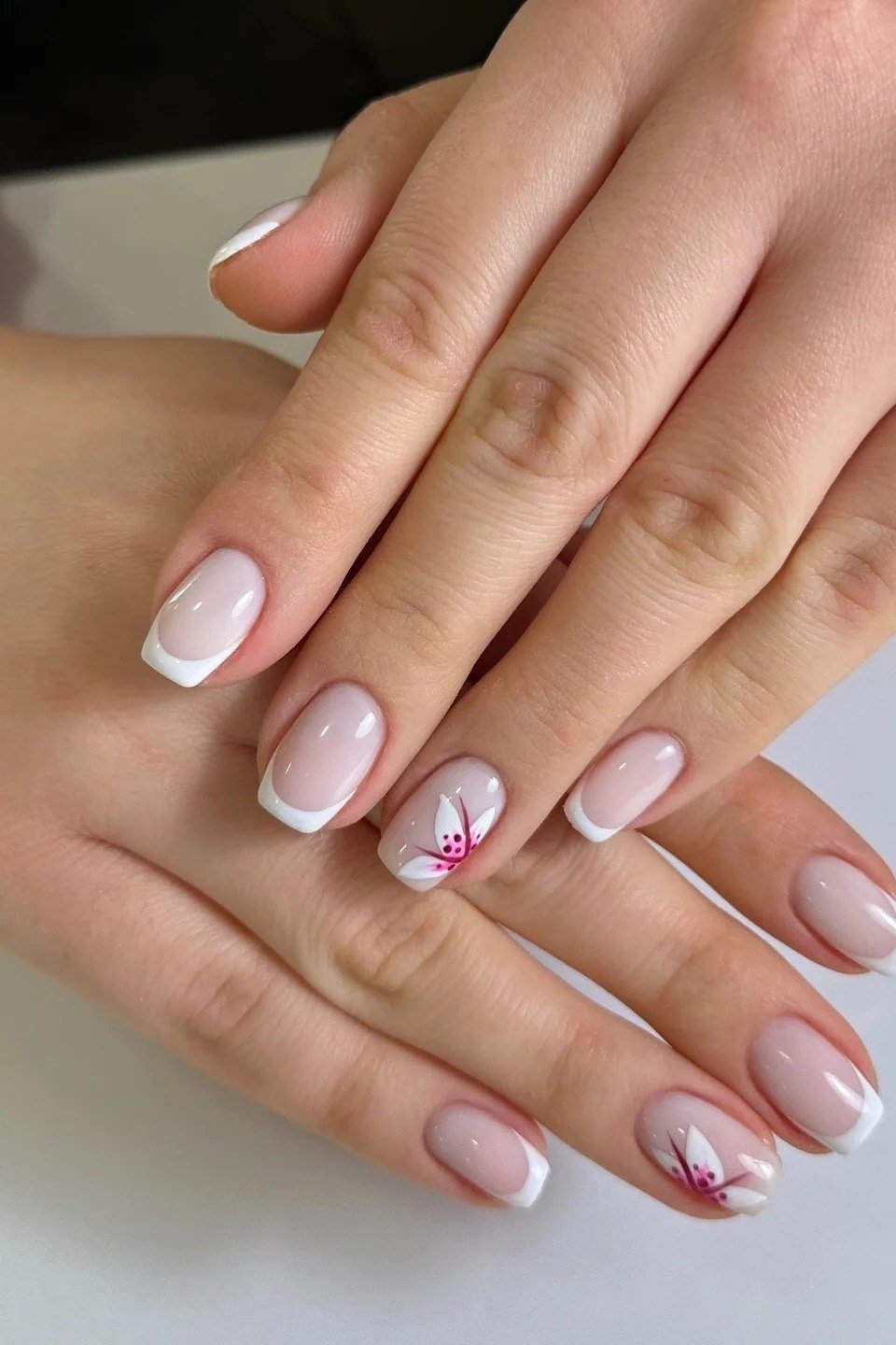 short almond baby boomer nails with floral accents