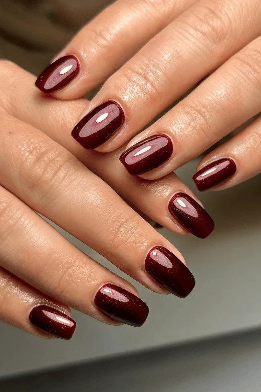 Glossy short burgundy almond, burgundy fall nail idea for women over 60