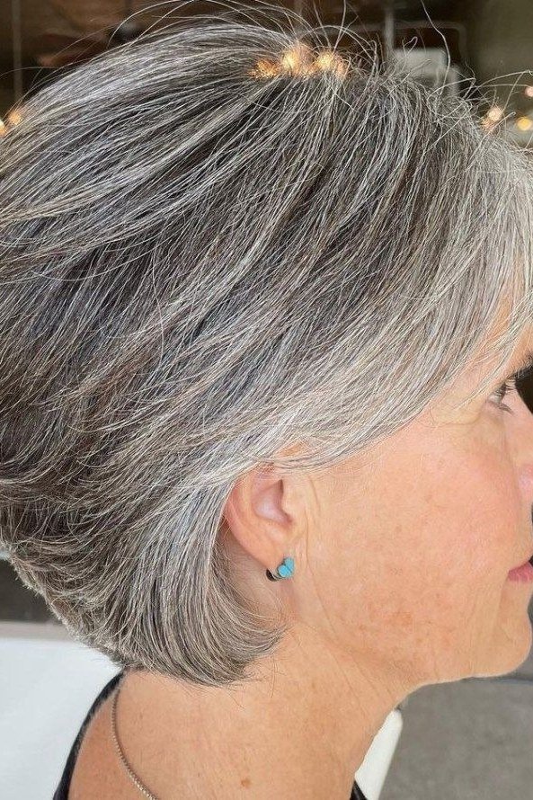 grey layered bob, side profile — chin-length layered bob hairstyle for women over 50