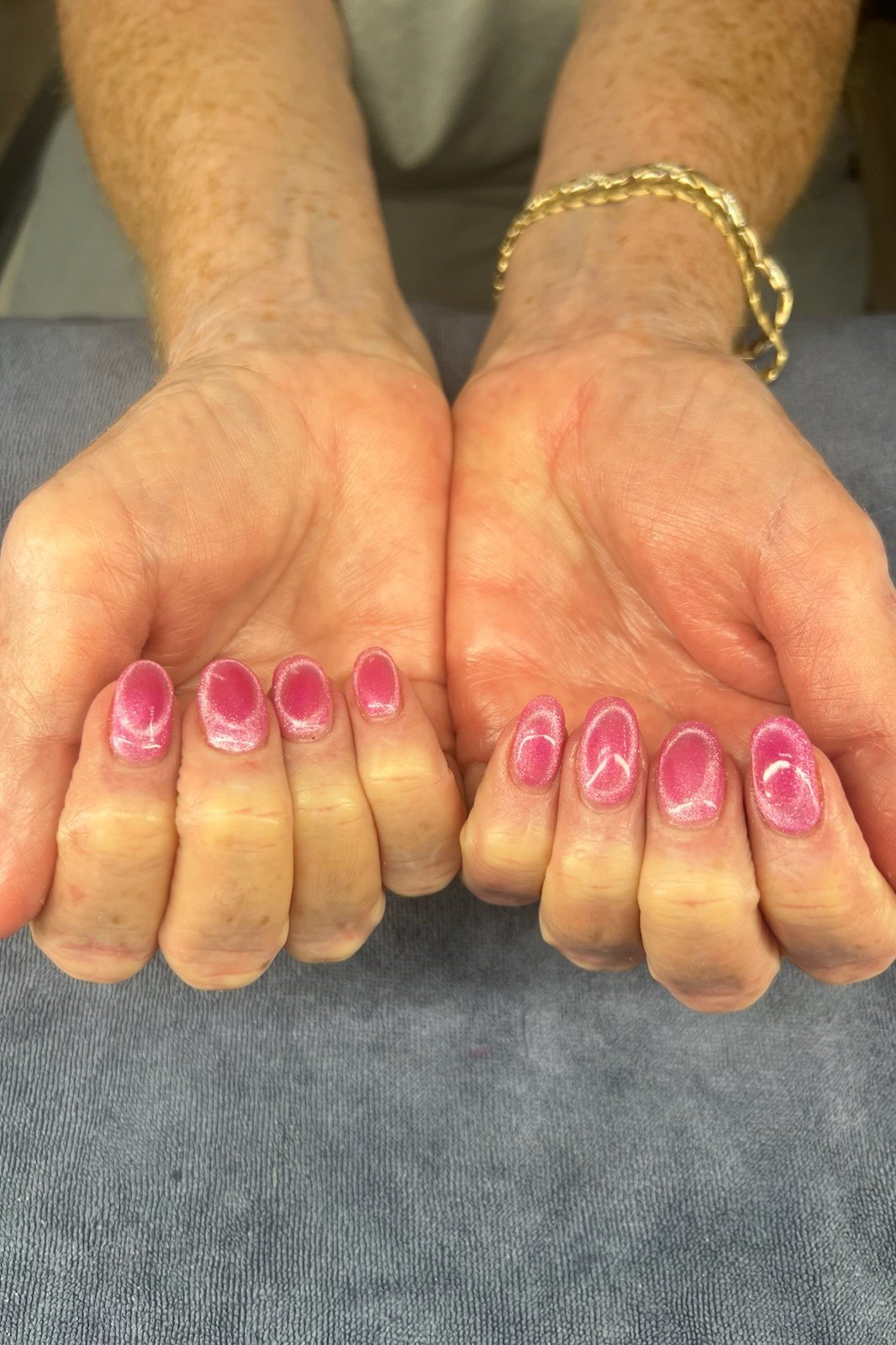 Bubblegum Pink Cat Eye Nails - Soft bubblegum pink with a fine magnetic shimmer covers these short, rounded nails.