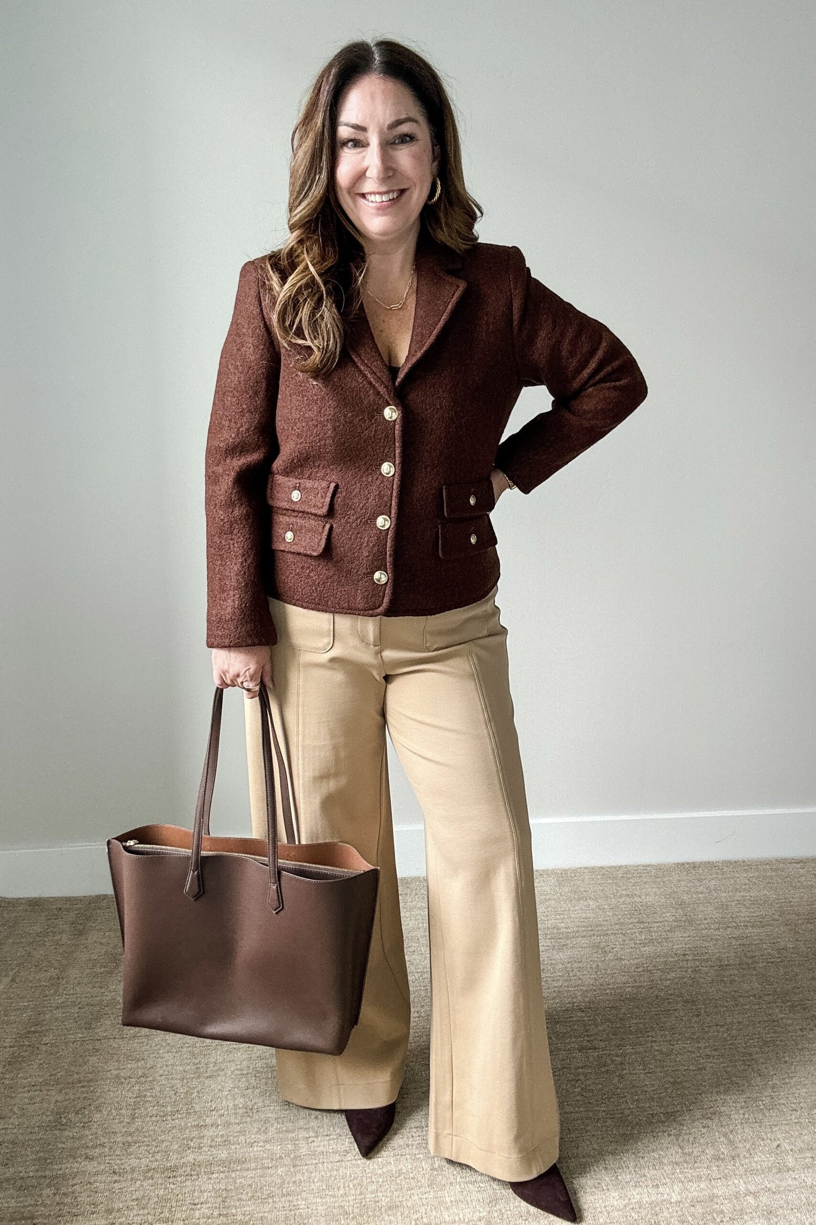 Work outfit for women over 40: brown tweed jacket with beige wide-leg trousers