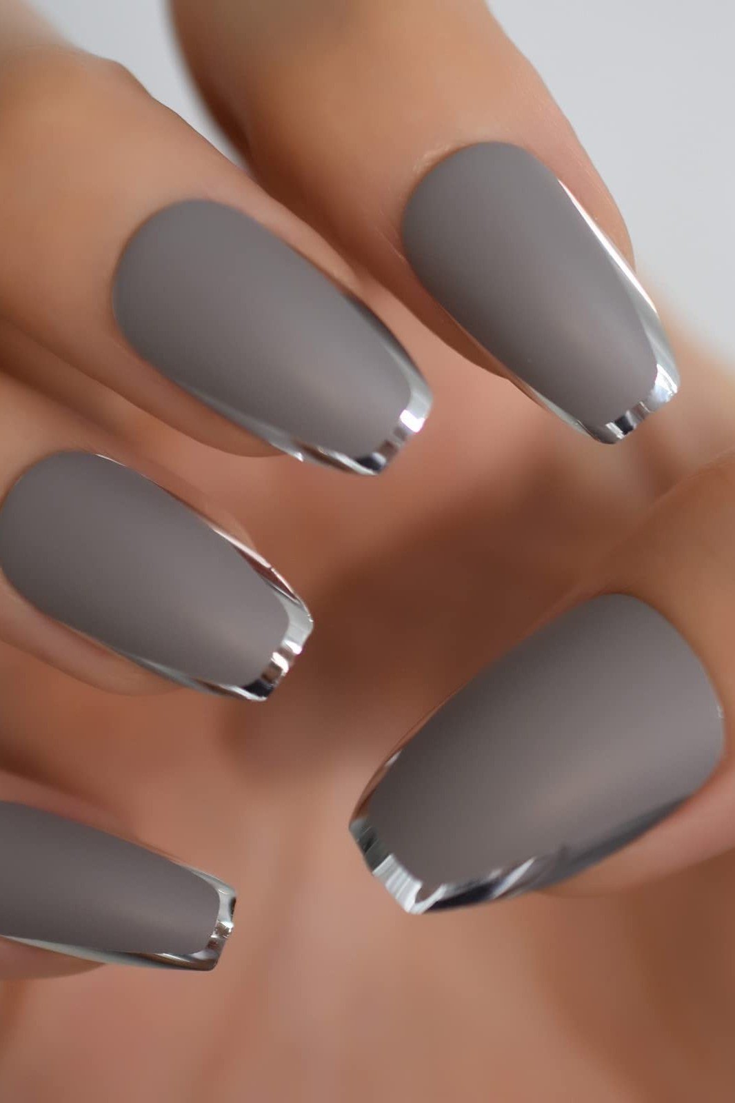 grey matte nails with chrome silver tips