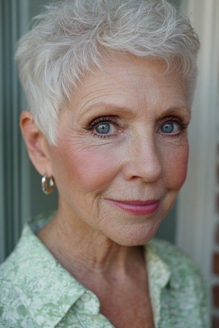white wispy pixie with soft bangs for women over 50 front view