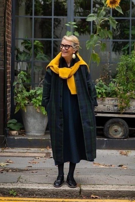 Long black coat with mustard scarf fall outfit idea for women over 60