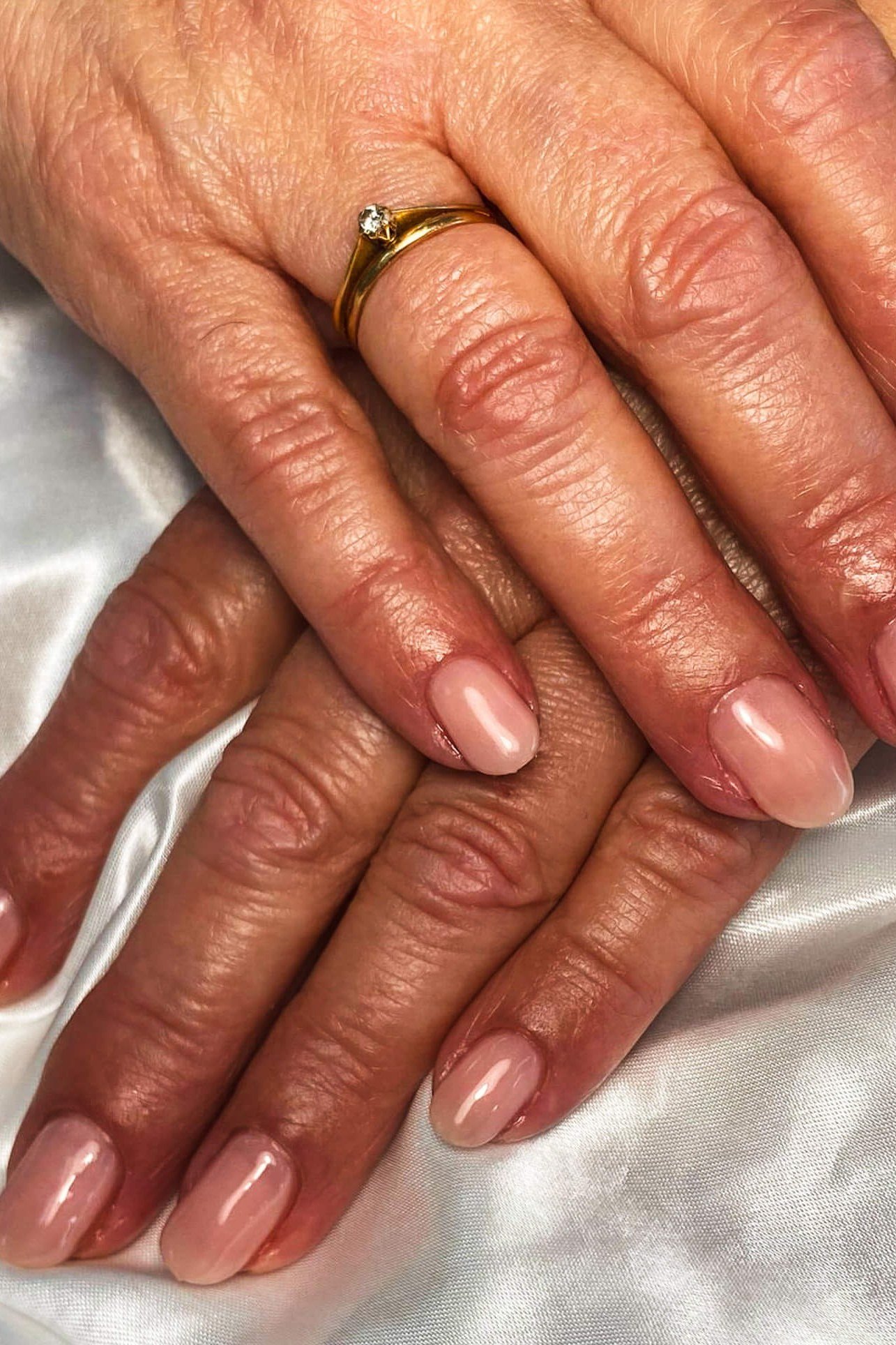 Best nails for women over 50: glossy nude on silk