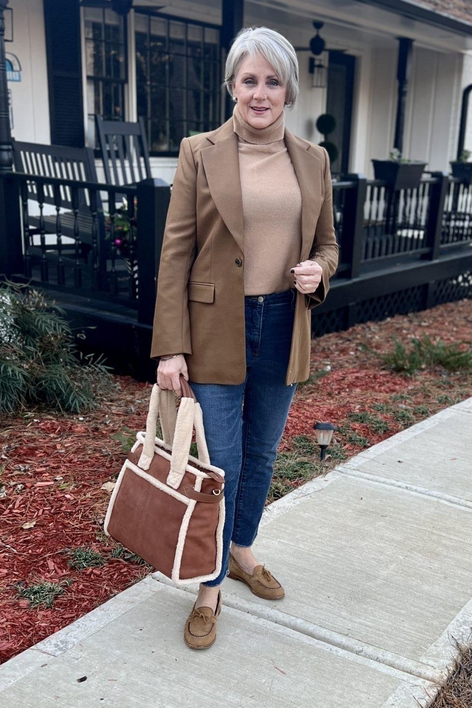 Chocolate brown blazer with beige turtleneck and jeans for women over 60