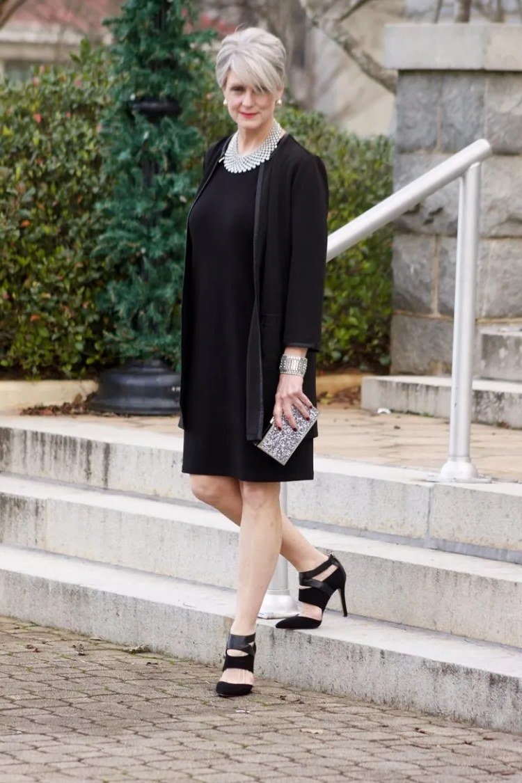 Black shift dress with white-trimmed neckline for women over 50