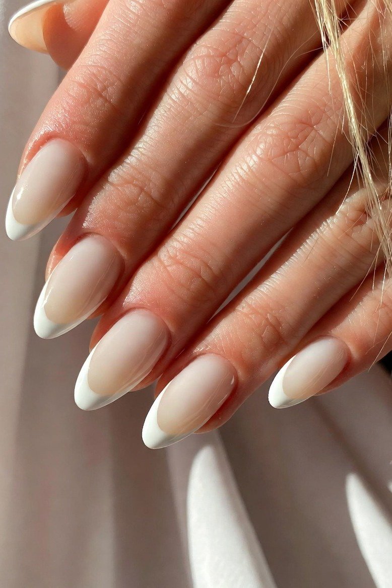 white nude baby boomer ombre on long almond nails