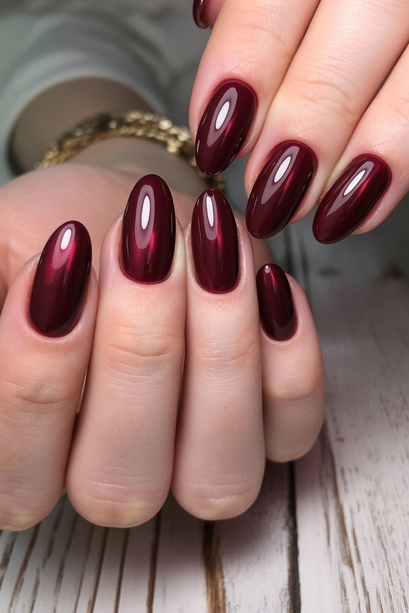 Glossy burgundy short oval, burgundy fall nail idea for women over 60