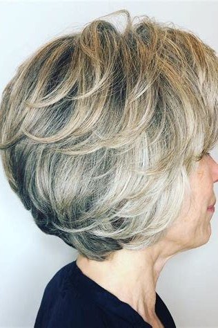 grey layered bob, side view — chin-length layered bob hairstyle for women over 50