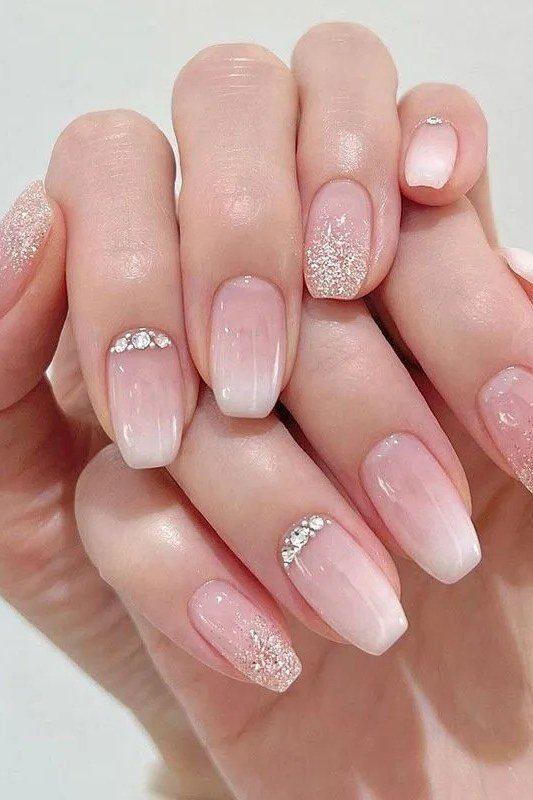 pink french nails with glitter accent nails