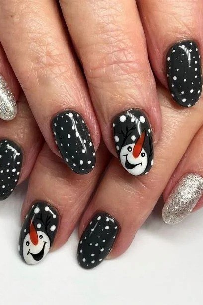 Black Nails with Snowman and Silver Glitter, fun winter nail idea for women over 60